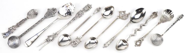 Ten Georgian and later silver and white metal teaspoons and a pickle fork, including some Indian and