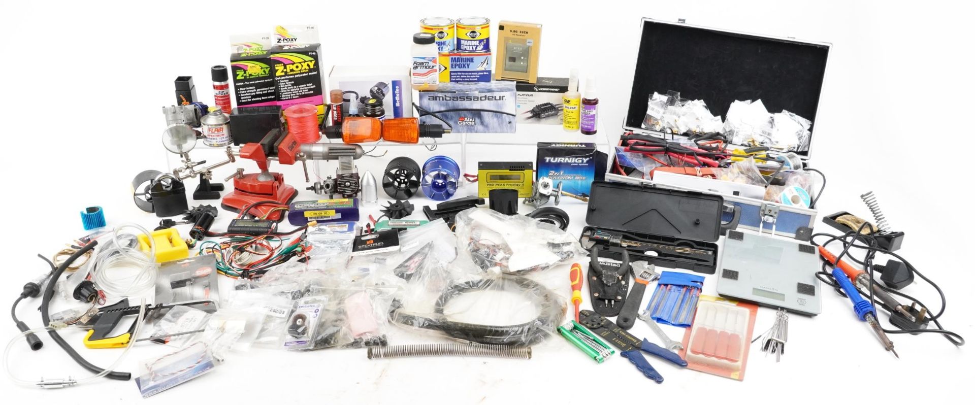 Collection of radio controlled mechanics and accessories including battery pack, Irvine engine,
