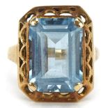 Gold baguette cut blue topaz ring with pierced setting, the topaz approximately 14.0mm x 10.20mm x