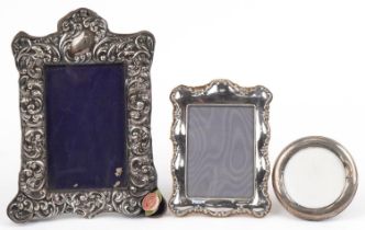 Two Victorian and later silver mounted photo frames and a silver plated easel photo frame, one