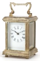 Miniature silver plated carriage clock with swing handle and enamelled dial having Roman numerals,