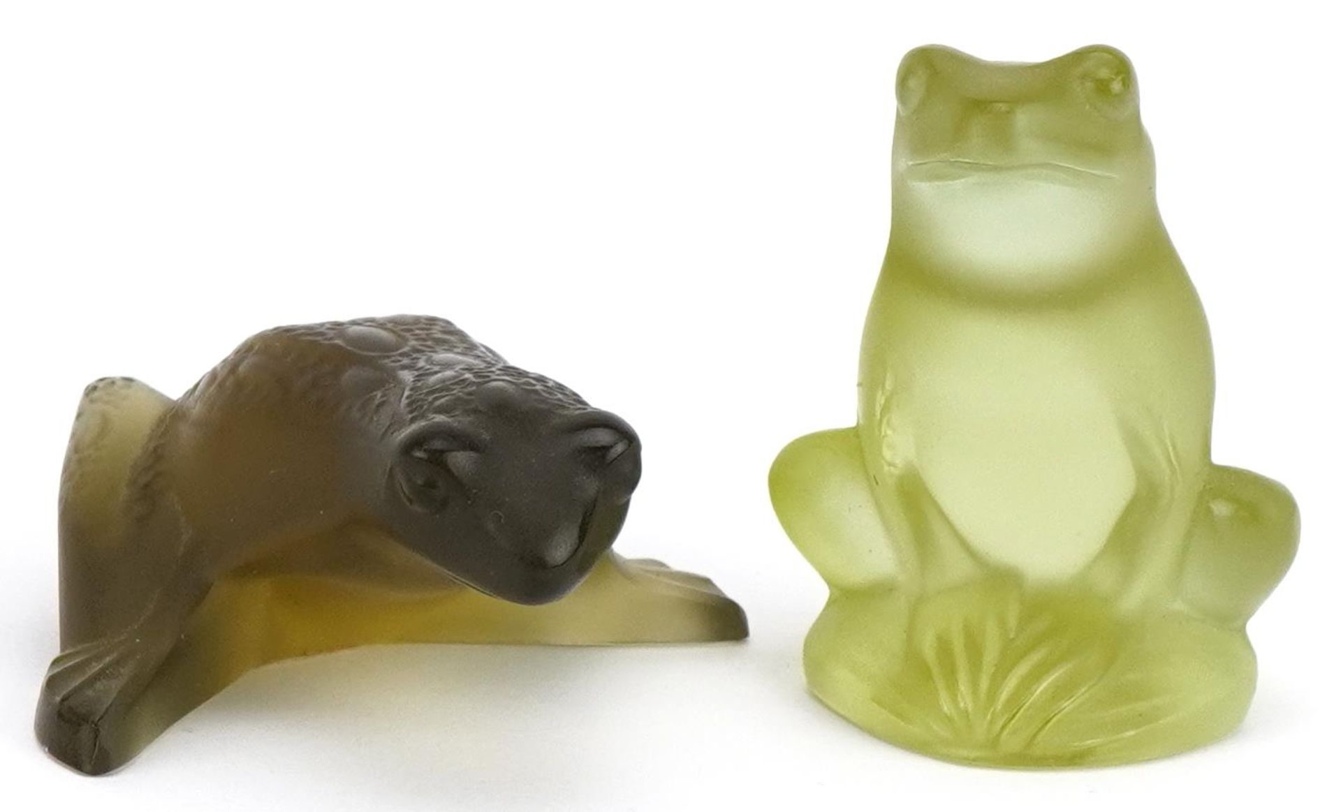 Lalique, two French frosted green glass frog paperweights, one with paper label, each etched Lalique