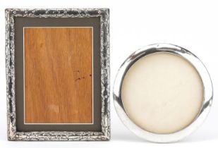 Two Victorian and later silver photo frames, one with embossed decoration, the largest 23.5cm x 18cm