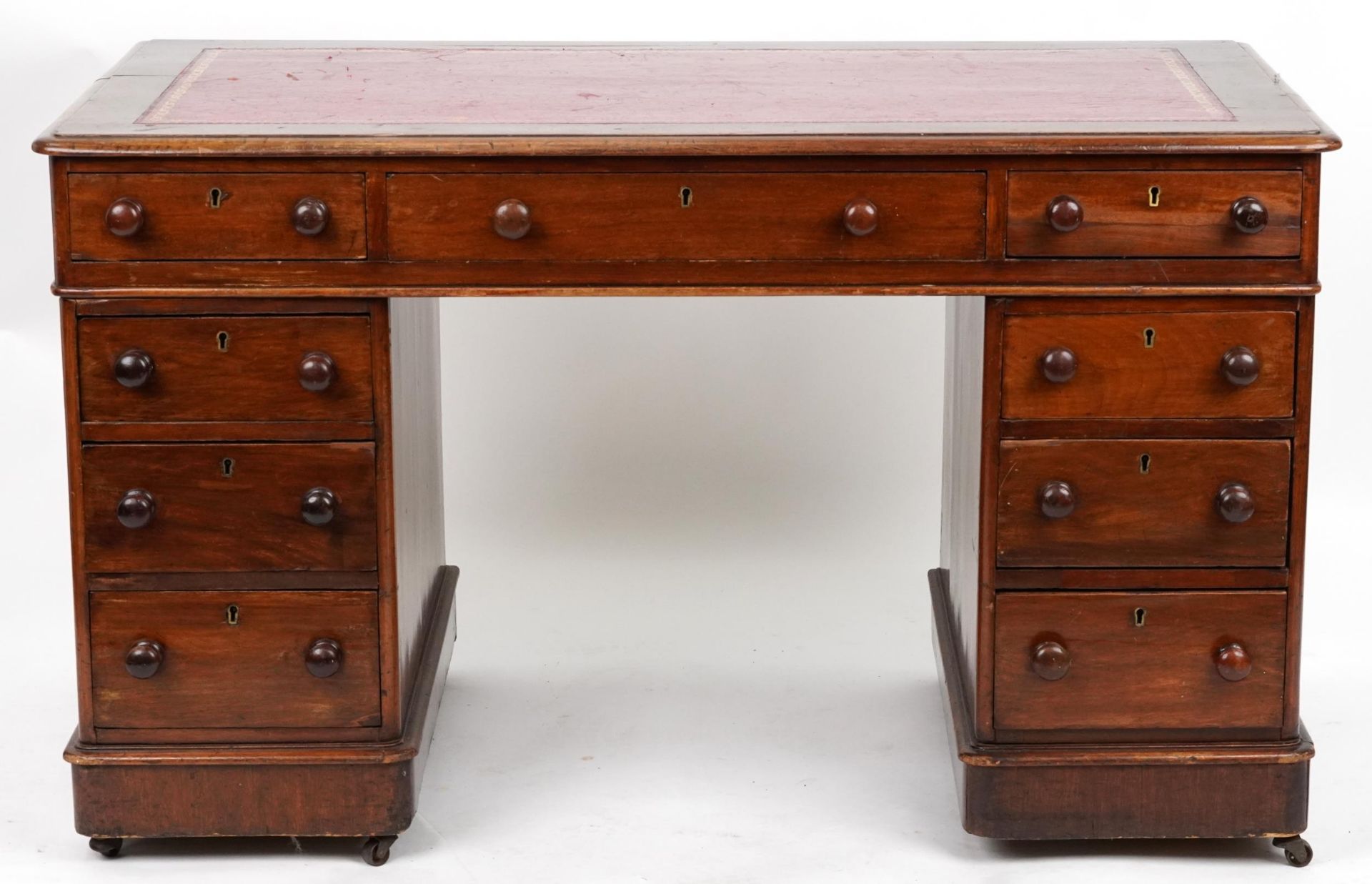 Victorian mahogany twin pedestal desk with tooled leather insert fitted with an arrangement of