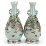 Pair of Japanese porcelain vases hand painted with a father and children, signed with calligraphy