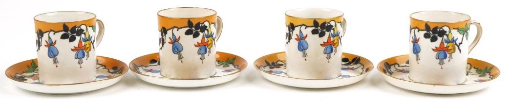 Four Foley china coffee cans with saucers decorated with stylised fruit, 6cm high : For further