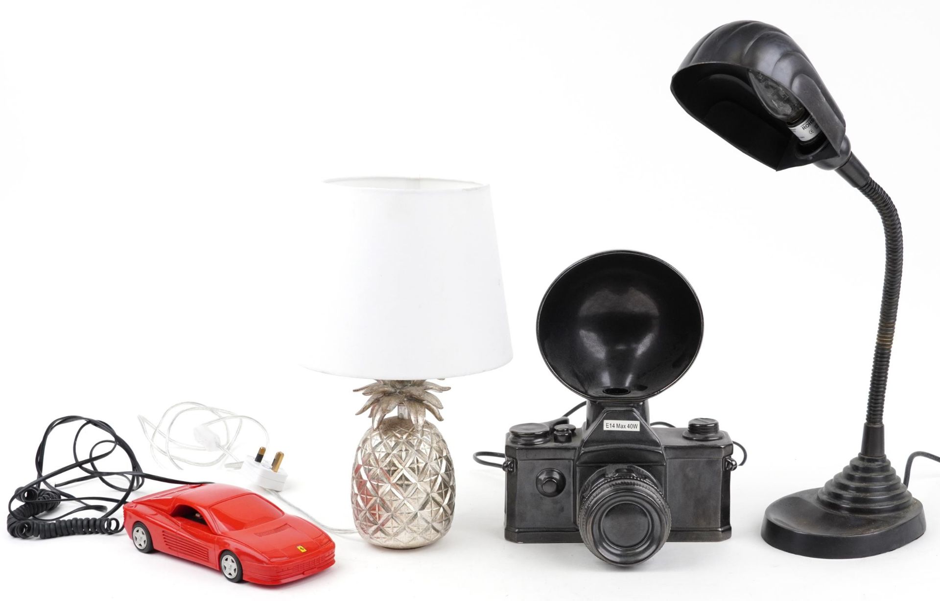 Three retro table lamps and a Betacom Ferrari Testarossa telephone, the lamps comprising a Laura