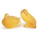 Lalique, two French frosted amber glass duck paperweights, each with paper labels and etched Lalique