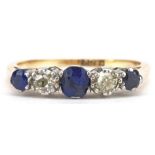 18ct gold graduated sapphire and diamond five stone ring, the central sapphire approximately 4.0mm