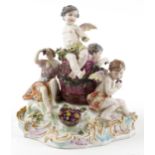 Manner of Meissen, 19th century porcelain 'Vintner' centrepiece modelled in the form of three