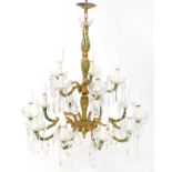 Ornate gilt metal seventeen branch chandelier with glass drops, hand painted with flowers,