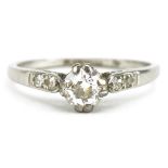 Platinum diamond solitaire ring with diamond set shoulders, the central diamond approximately 0.35