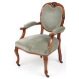 Victorian style armchair with olive green upholstery on cabriole legs with casters, 95cm high :