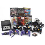 Vintage Nintendo Game Cube games console with controllers and various games including Super Mario