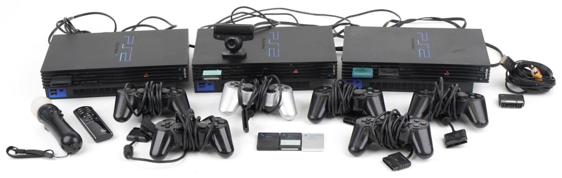 Three PlayStation 2 games consoles with controllers and accessories : For further information on