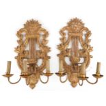 Pair of 19th century French gilt wood three branch wall sconces in the form of a lyres, each 61cm