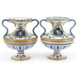 Gien, pair of 19th century French faience glazed Maiolica twin handled vases hand painted with