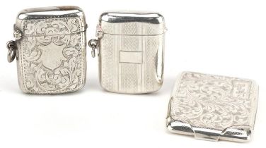 Two Edwardian and later silver vestas and a silver match case with gilt interior, the largest 6cm in