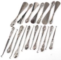 Nineteen Victorian and later silver handled shoehorns and buttonhooks, the largest 23cm in