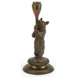 Victorian brass candlestick in the form of a bear hugging a trunk, 23cm high : For further