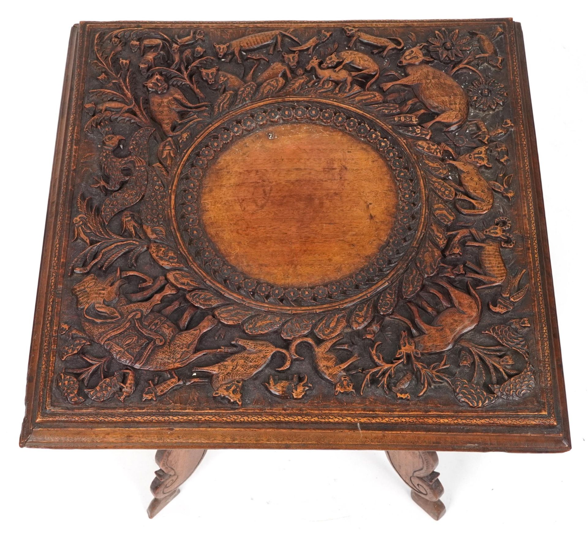 Anglo Indian hardwood folding side table, finely and deeply carved with an elephant and wild animals - Image 3 of 4