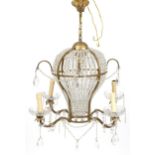 Ornate gilt metal and glass four branch chandelier with four girondelles and drops, overall 88cm