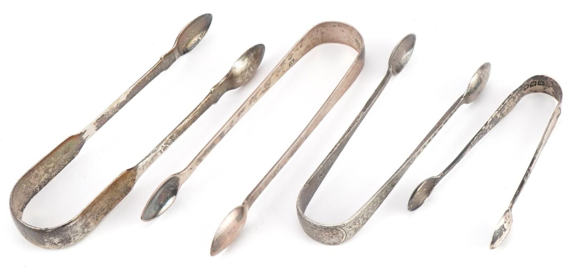 Four pairs of Georgian and later silver sugar tongs, the largest 14cm in length, total 114.6g : - Image 2 of 4
