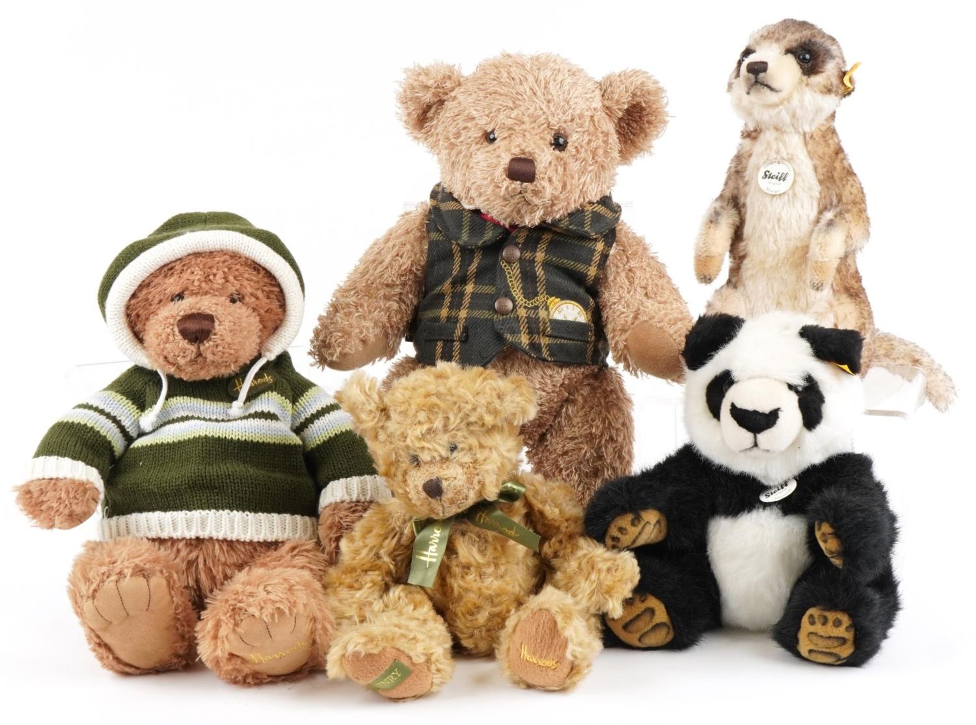 Three Harrod's teddy bears and two Steiff examples comprising Mungo the Meerkat and Manschli the