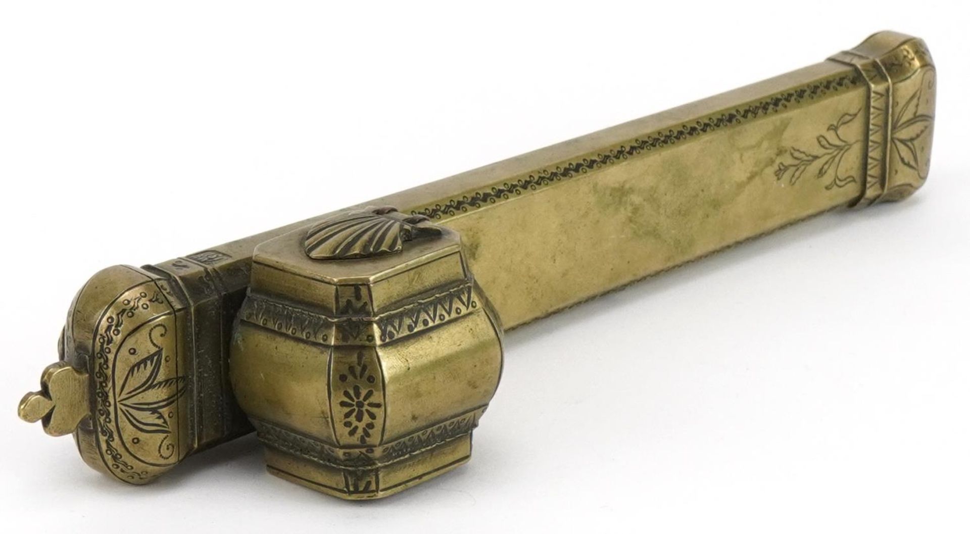 Islamic brass divit pen box engraved with flowers, impressed with calligraphy, 25.5cm in length :