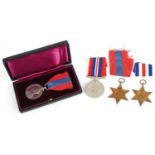 Three British military World War II medals and a George V Faithful Service medal with fitted case
