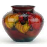 William Moorcroft pottery flambe vase hand painted in the Leaves and Berry pattern, impressed and