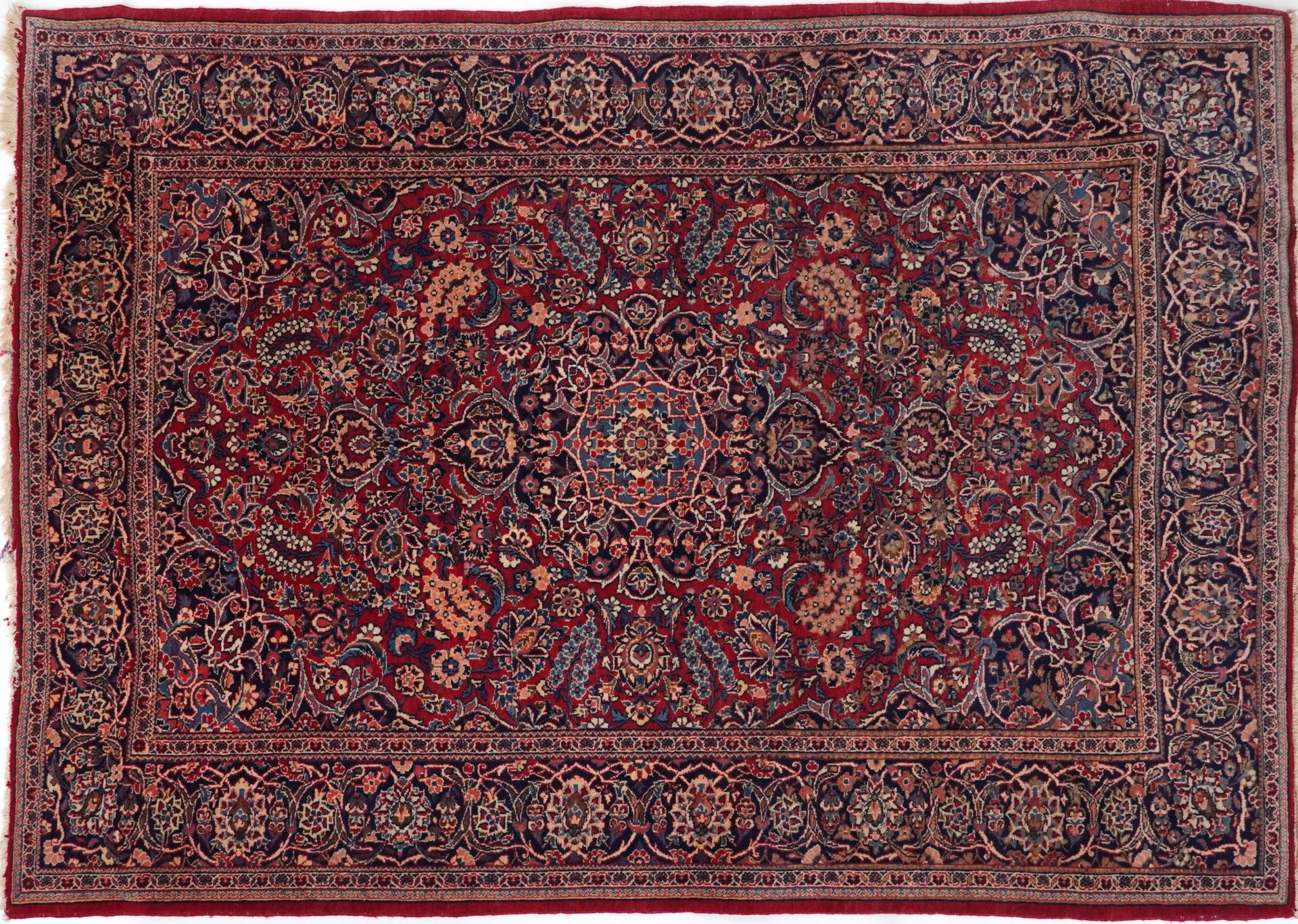 Rectangular Persian Sarouk type part silk red ground rug having an allover floral design, 214cm x