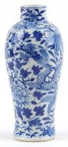 Chinese blue and white porcelain baluster vase hand painted with dragons amongst flowers, six figure