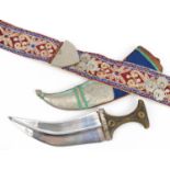Omani Jambiya dagger with horn handle and white metal mounts on embroidered belt, the dagger 39.