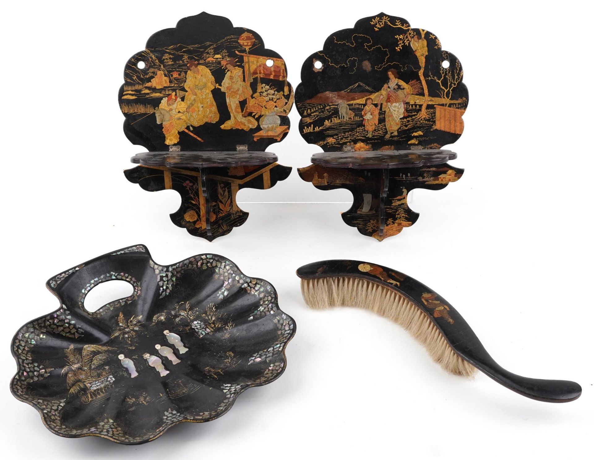Black lacquered and papier mache chinoiserie sundry items comprising a pair of folding wall