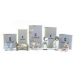 Five Lladro porcelain figures and a pair of Chinese porcelain Chinaman salt and pepper casters,