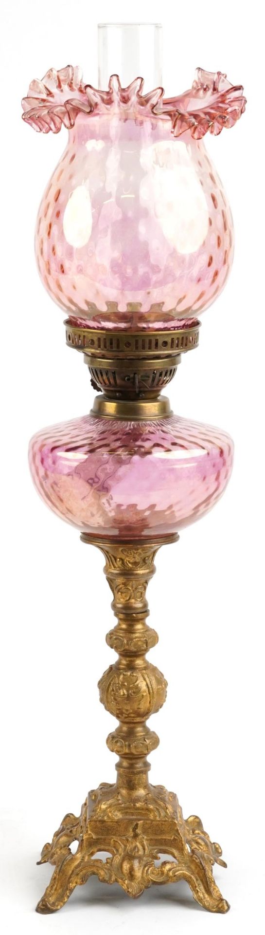 Ornate gilt painted oil lamp with iridescent cranberry glass shade and reservoir, 68.5cm high : - Image 2 of 3