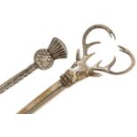Two Scottish silver kilt pin brooches including one in the form of a stag's head, the largest 12cm