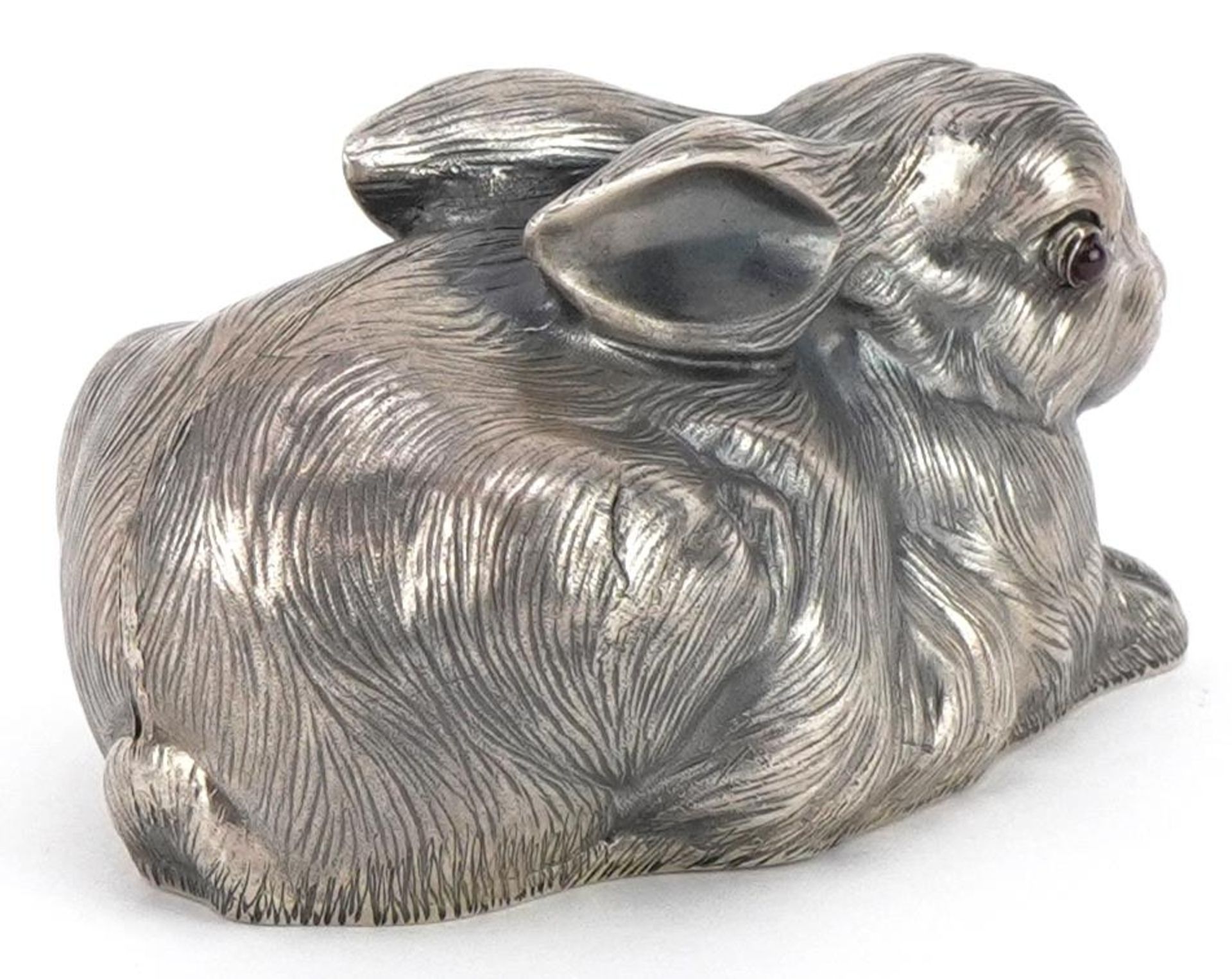 Silver recumbent rabbit with cabochon ruby eyes, impressed Russian marks to the base, 6.5cm in - Image 2 of 4