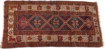 Rectangular Turkish red ground rug having an allover repeat floral design, 258cm x 132cm : For