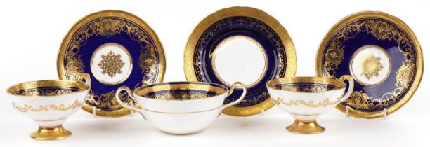 Aynsley Kenilworth cobalt blue ground soup cup with saucer and two similar teacups with saucers,