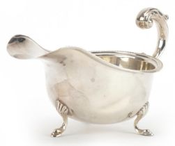 S Blanckensee & Son Ltd, George V silver three footed sauceboat, Birmingham 1934, 17cm in length,