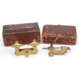 Two antique horological interest watchmaker's brass depthing tools housed in silk lined fitted