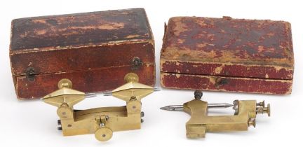 Two antique horological interest watchmaker's brass depthing tools housed in silk lined fitted