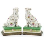 Pair of Victorian style porcelain bookends with bronzed bases in the form of dogs, each 19cm