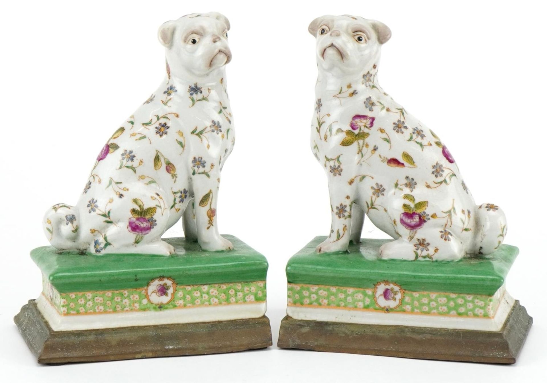 Pair of Victorian style porcelain bookends with bronzed bases in the form of dogs, each 19cm