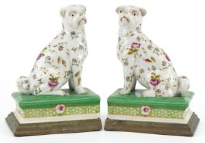 Pair of Victorian style porcelain bookends with bronzed bases in the form of dogs, each 19cm