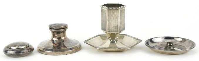 Silver objects including an engine turned match stand and a capstan inkwell, the largest 7.5cm high,