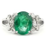 18ct white gold oval emerald and marquise cut diamond cluster ring, the emerald approximately 2.52