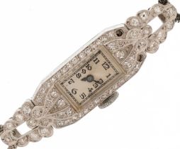 Art Deco ladies white gold and diamond cocktail watch with a white metal watch strap and 9ct white